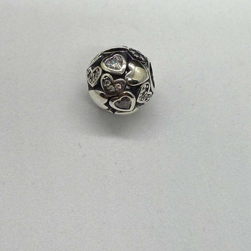 Silver Intricate Metalwork Bracelet charm with Vintage Bohemian Aesthetic